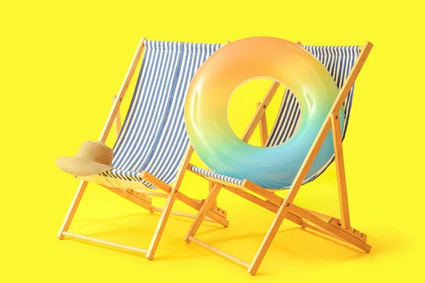 Wooden Deck Chairs Inflatable Ring Yellow Background — 스톡 사진