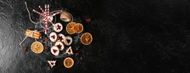 Tasty Linzer cookies on dark background with space for text