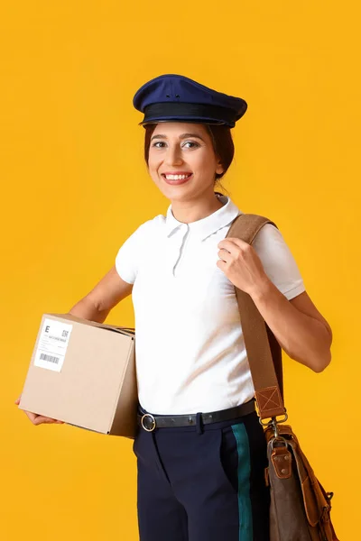 Young Postwoman Bag Parcel Yellow Background — 스톡 사진