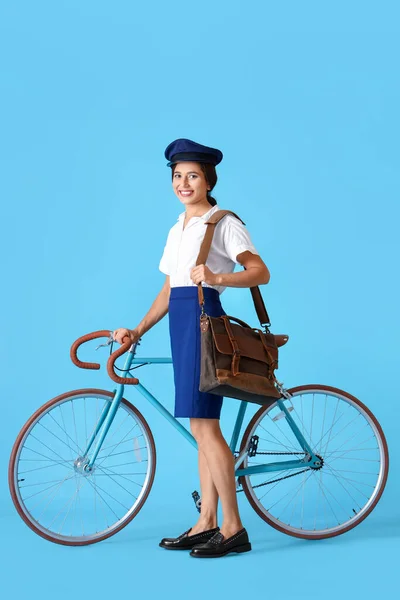 Young Postwoman Bicycle Blue Background — Stock fotografie