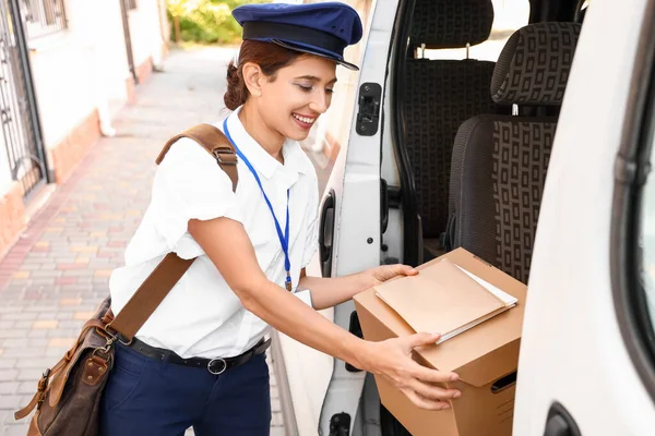Young Postwoman Taking Box Letters Car — Stok fotoğraf