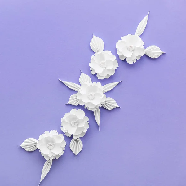 Composition with origami flowers and leaves on violet background