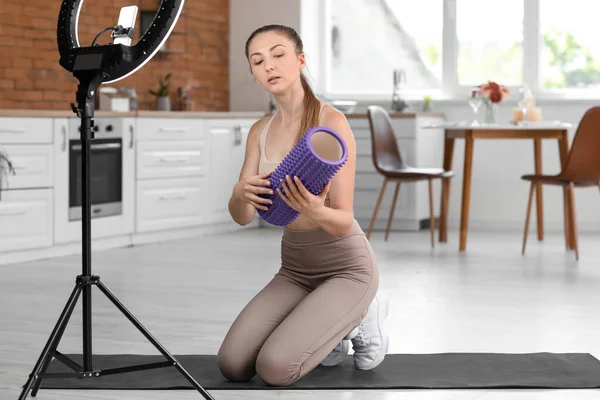 Young Woman Foam Roller Recording Video Kitchen — Foto Stock