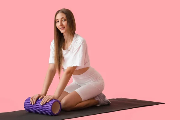 Young Woman Training Foam Roller Pink Background — 图库照片
