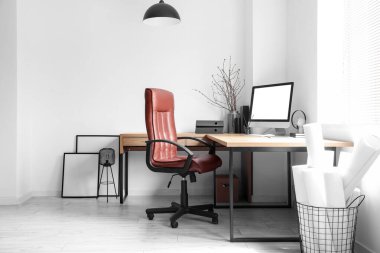 Modern workplace with chair in light office