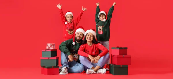Happy Family Santa Hats Christmas Gifts Red Background — Stockfoto
