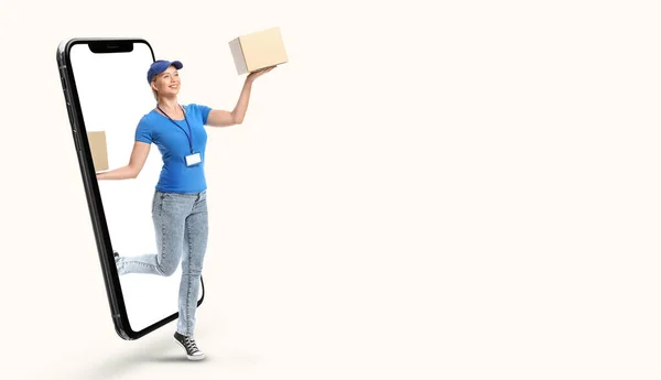 Female Courier Parcels Jumping Out Smartphone Screen Light Background Space — Φωτογραφία Αρχείου