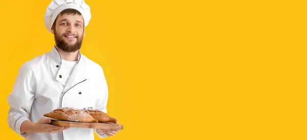 Young Baker Fresh Bread Yellow Background Space Text — Stockfoto