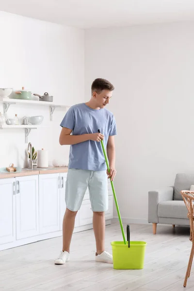 Handsome Young Man Mopping Floor Modern Kitchen —  Fotos de Stock