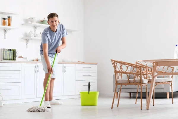 Handsome Young Man Mopping Floor Modern Kitchen — Foto Stock