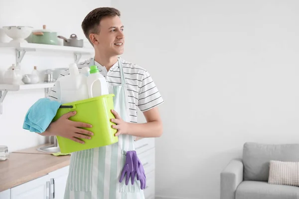 Young Man Holding Bucket Cleaning Supplies Kitchen — Foto de Stock