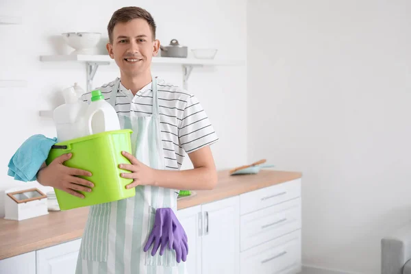 Young Man Holding Bucket Cleaning Supplies Kitchen — Foto de Stock