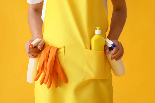 Young Man Apron Cleaning Supplies Yellow Background Closeup — Foto Stock