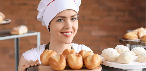 Happy Female Baker Fresh Buns Kitchen Stock Image
