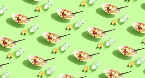 Many Bowls Caesar Salad Glasses Water Green Background Pattern Design — Stock Fotó