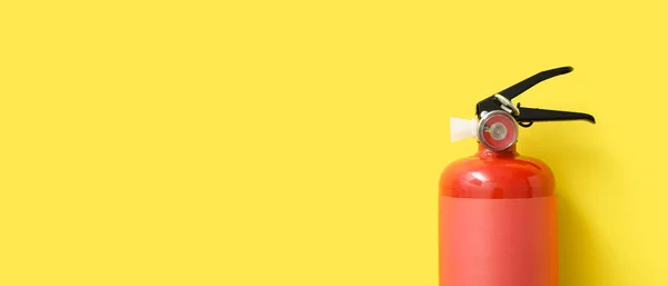 Fire Extinguisher Yellow Background Space Text — стоковое фото