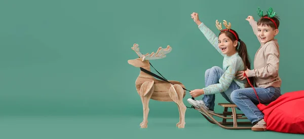 Funny Little Children Sledge Wooden Reindeer Green Background Space Text — Stockfoto