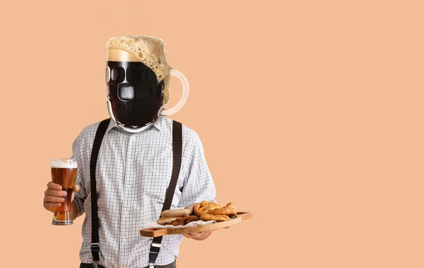 Man in traditional German clothes, with mug of beer instead of his head and snacks on beige background. Octoberfest celebration