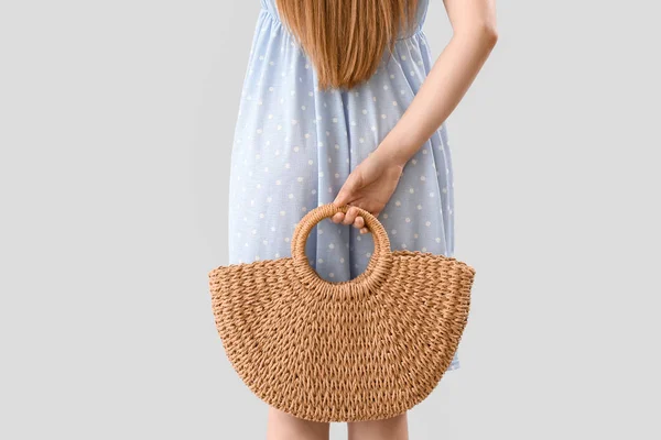 Young Woman Holding Rattan Bag Her Back Light Background —  Fotos de Stock