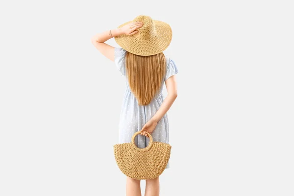 Young Woman Wicker Hat Holding Rattan Handbag Light Background — Stok fotoğraf