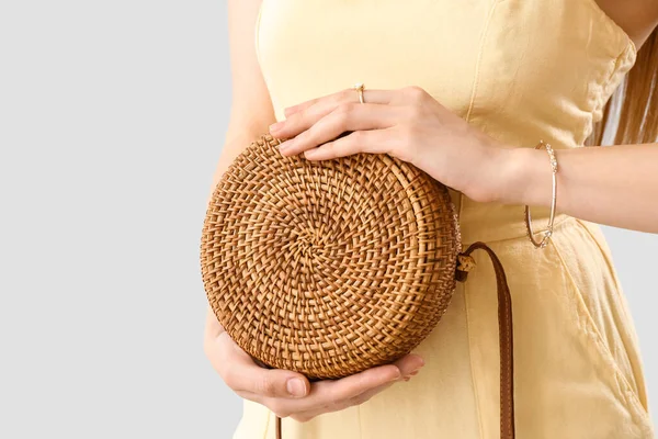 Woman Stylish Jewelry Holding Rattan Handbag Light Background — Stock Photo, Image