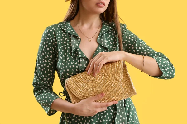 Woman Stylish Dress Holding Elegant Rattan Handbag Yellow Background Closeup — стоковое фото