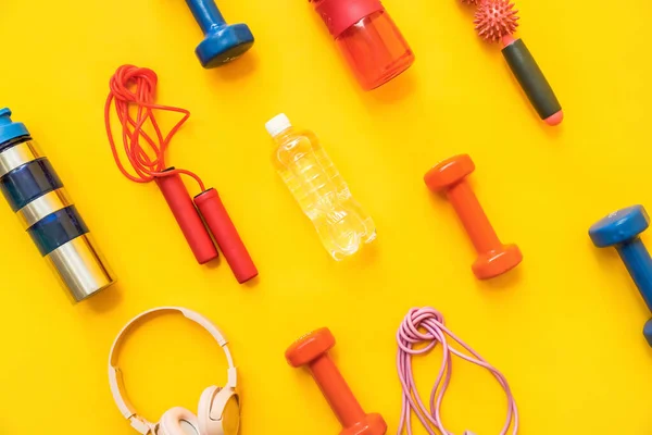 Different Sports Equipment Bottle Water Headphones Yellow Background — 스톡 사진