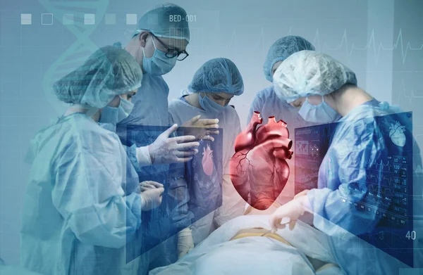 Surgeons using digital twin technology while operating patient in modern hospital