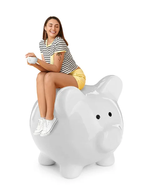 Beautiful Young Woman Cup Coffee Sitting Big Piggy Bank White — Stock Photo, Image