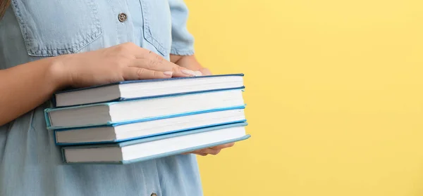 Woman Holding Stack Books Yellow Background Closeup — Fotografia de Stock