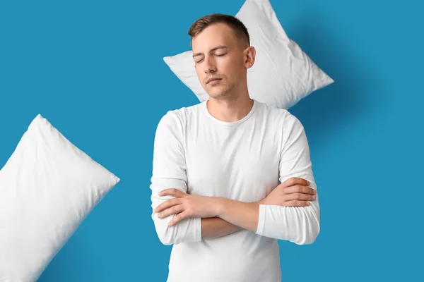 Young Man Pillows Blue Background — Stockfoto