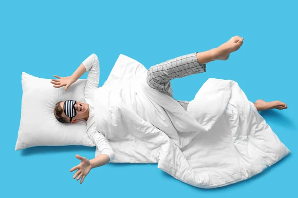 Young Man Sleeping Mask Pillow Blanket Lying Blue Background — Fotografie, imagine de stoc