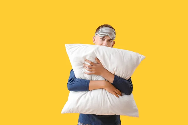 Young Man Sleeping Mask Hugging Pillow Yellow Background — Stockfoto