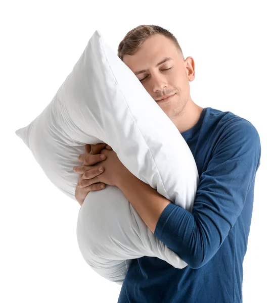 白い背景の上の柔らかい枕と若い男 — ストック写真