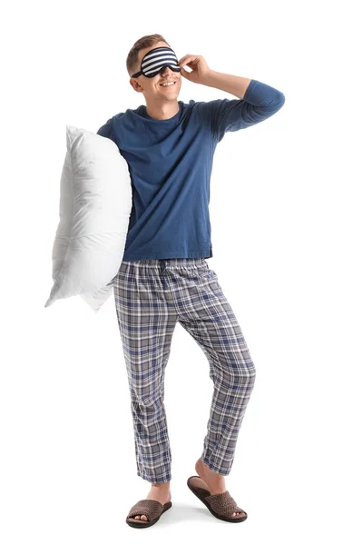 Beyaz Arka Planda Uyku Maskesi Yastığı Olan Genç Bir Adam — Stok fotoğraf