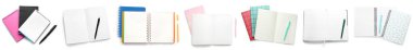 Set of notebooks with pens on white background