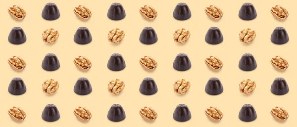Many Tasty Chocolate Candies Nuts Beige Background Pattern Design — Φωτογραφία Αρχείου