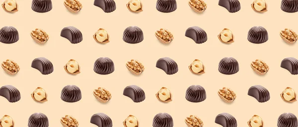 Many Tasty Chocolate Candies Nuts Beige Background Pattern Design — Φωτογραφία Αρχείου