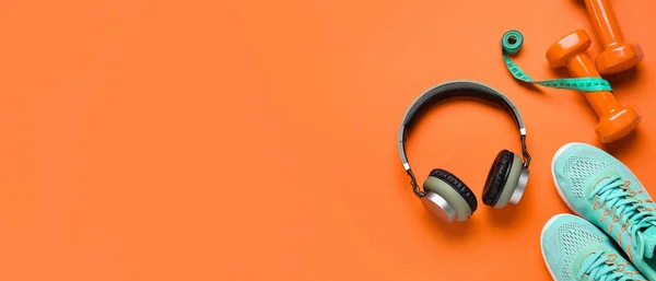 Sports Shoes Headphones Measuring Tape Dumbbells Orange Background Space Text — Foto de Stock