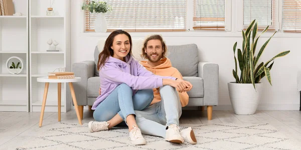 Happy Young Couple Sitting Soft Carpet Home —  Fotos de Stock