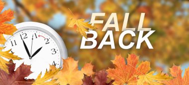 Clock and autumn leaves outdoors. Fall back concept