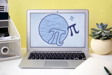 Modern laptop on table. International Pi Day