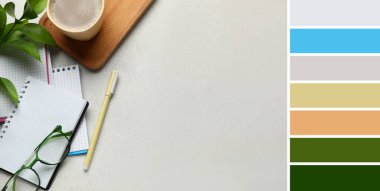 Notebooks with eyeglasses, pen and cup of coffee on light background. Different color patterns