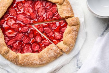 Sweet strawberry galette on light background, closeup