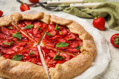 Sweet strawberry galette on light background, closeup
