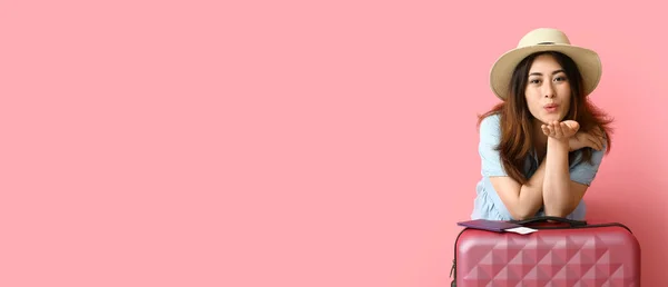 Female Asian Tourist Suitcase Blowing Kiss Pink Background Space Text — Stock Fotó