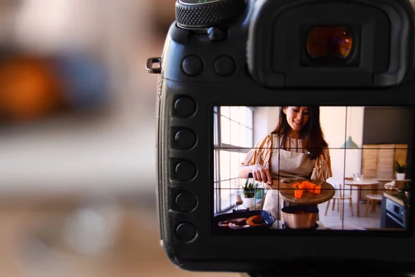 Young Woman Putting Pumpkin Saucepan Display Photo Camera Kitchen Closeup — Stock fotografie