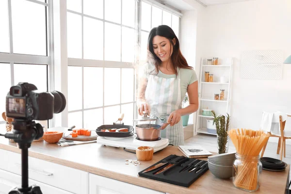 Young Asian Woman Boiling Pumpkin While Recording Video Class Kitchen — Stok fotoğraf