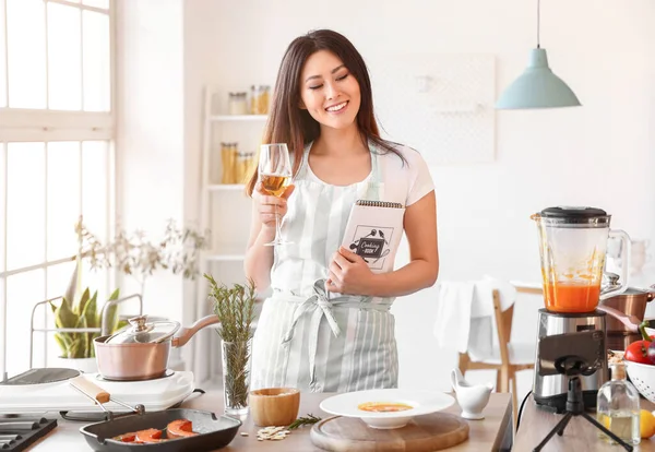 Young Asian Woman Glass Wine Cooking Book Watching Cooking Video —  Fotos de Stock