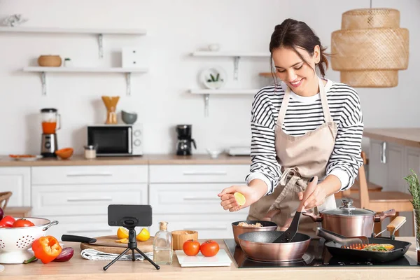 Young Woman Squeezing Lemon Frying Pan While Cooking Video Tutorial —  Fotos de Stock